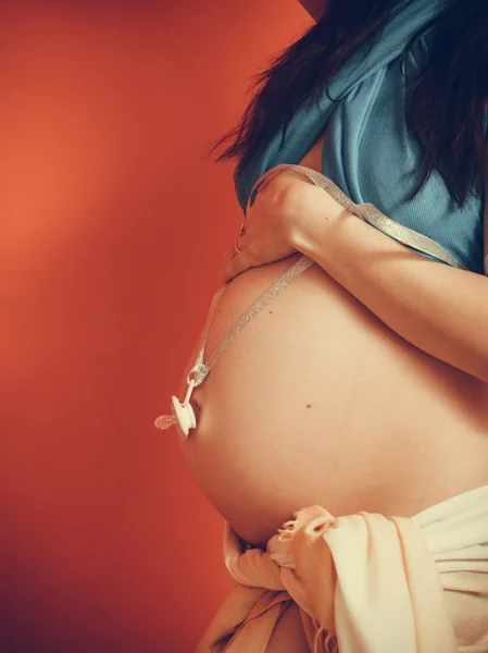 Woman holding dummy — Stock Photo, Image