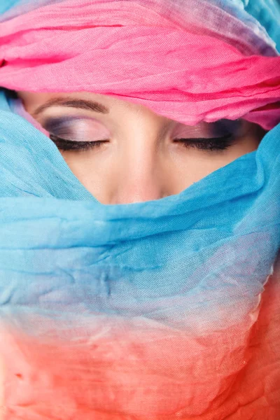 Woman makeup on eyes hiden her face with shawl — Stock Photo, Image