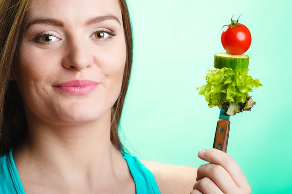 Woman holding vegetables — Stock Photo, Image