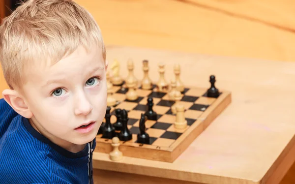 Little boy learn to play chess. — Stock Photo, Image