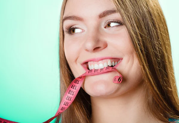 Woman holding pink measuring tape — Stock Photo, Image