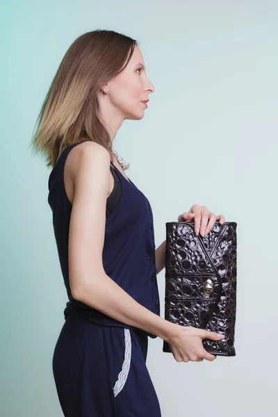 Elegant fashion woman with leather handbag — Stock Photo, Image