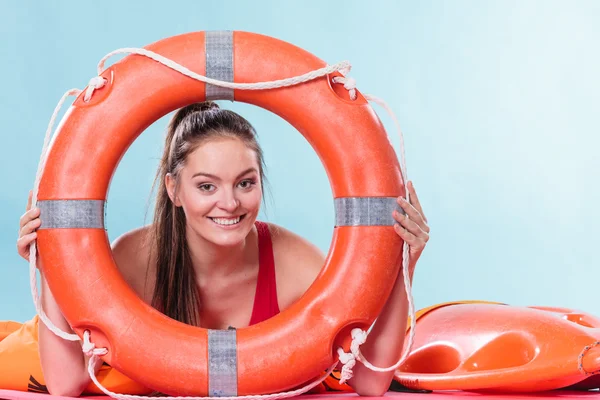 Happy lifeguard with ring buoy. — Stock Photo, Image