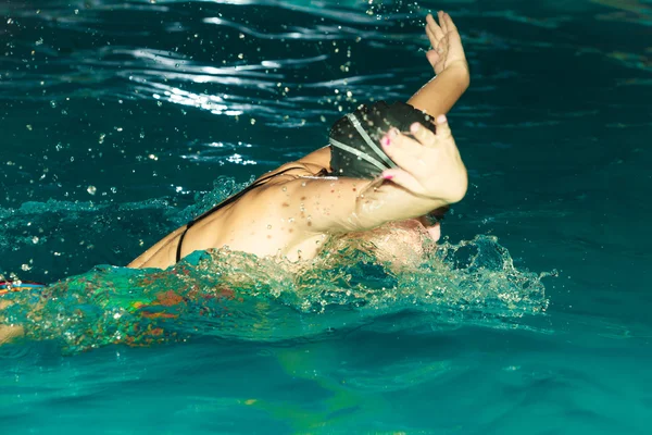 Athlete performing butterfly style stroke — Stock Photo, Image