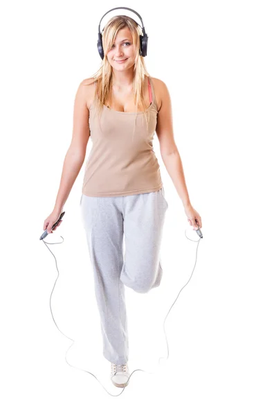 Sporty girl plus size doing exercise with jump rope. — Stock Photo, Image