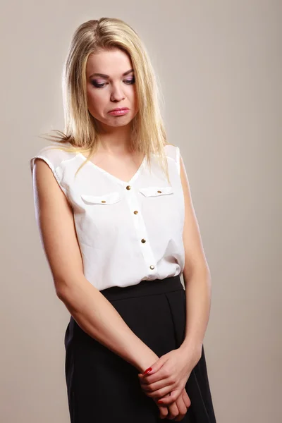 Sad unhappy girl portrait on gray — Stock Photo, Image