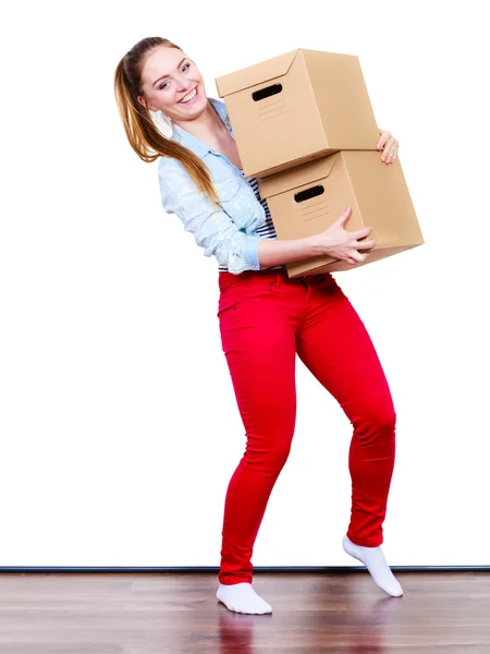 Woman moving in carrying  boxes Stock Photo