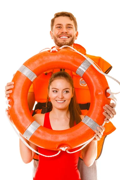 Lifeguards in life vest with ring buoy having fun. — Stock Photo, Image