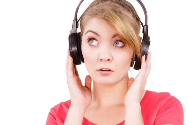 Woman sad girl in big headphones listening music — Stock Photo, Image