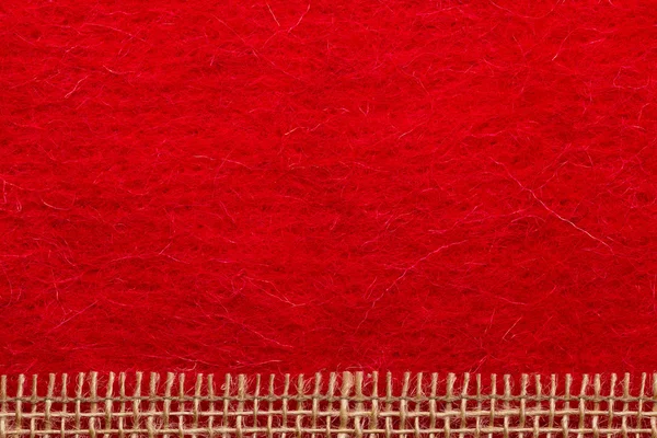 Jute mesh over red background — Stock Photo, Image