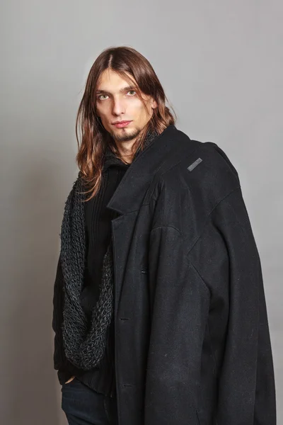 Handsome fashion man portrait wearing black coat. — Stock Photo, Image