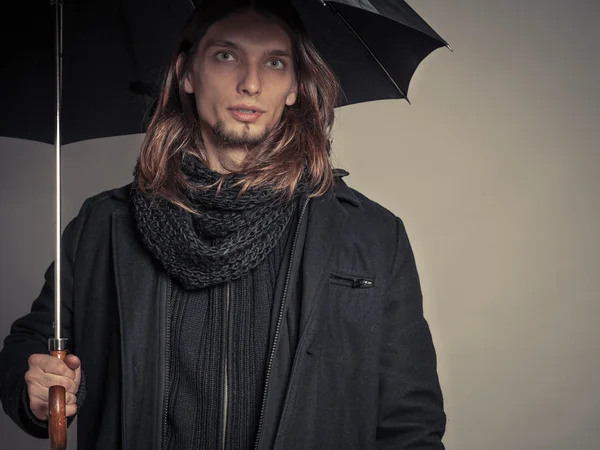 Handsome fashion man portrait wearing black coat. — Stock Photo, Image