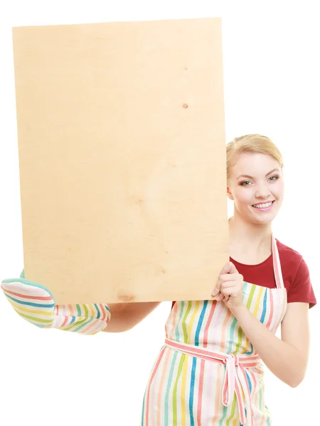 Housewife holds wooden board with copy space — Stock Photo, Image