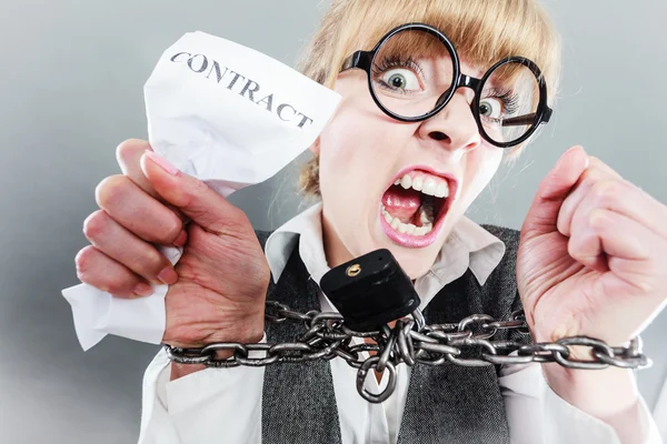 Furious woman with chained hands and contract — Stock Photo, Image