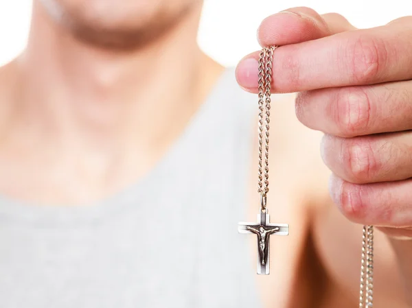 Man holding cross pendant. Catholic religion faith — Stock fotografie