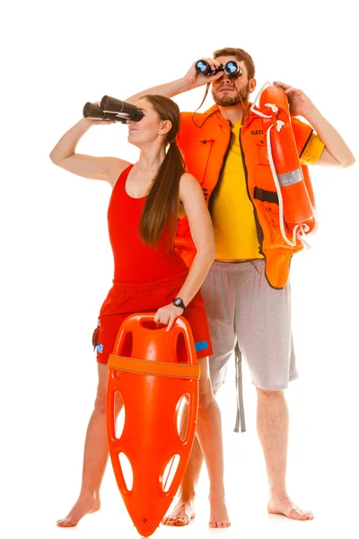 Lifeguards with rescue ring buoy and life vest. — Stock Photo, Image