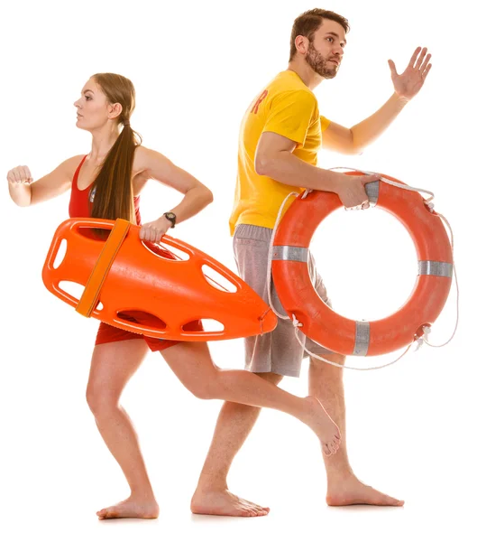 Lifeguards running with rescue ring buoy on duty. — Stock Photo, Image