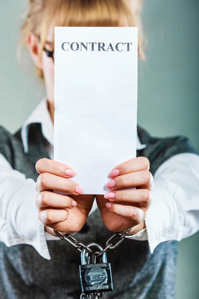 Businesswoman with chained hands holding contract — Stock Photo, Image