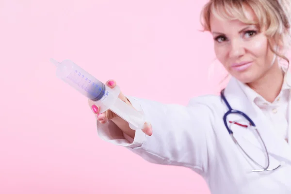 Nurse with big syringe. — Stock Photo, Image