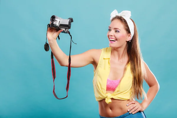 Happy pin up girl woman filming with camcorder. — Stock Photo, Image