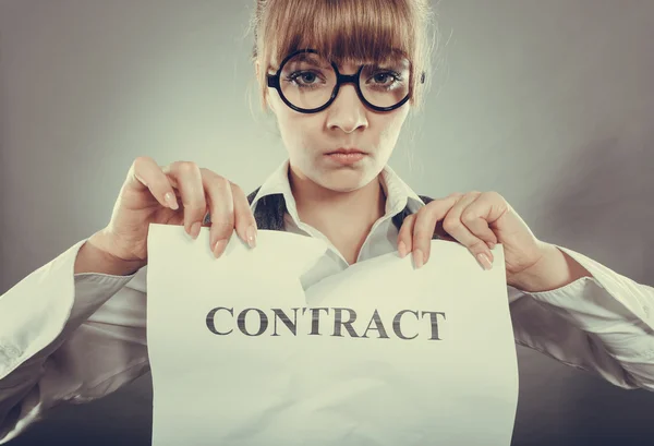Unhappy business woman showing crumpled contract — Stock Photo, Image