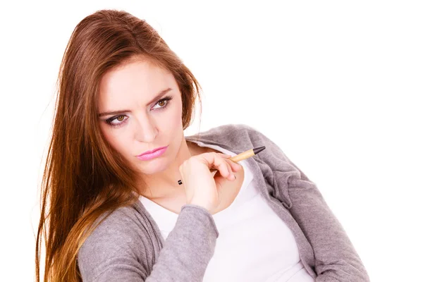 Woman thinking holds pen — Stock Photo, Image