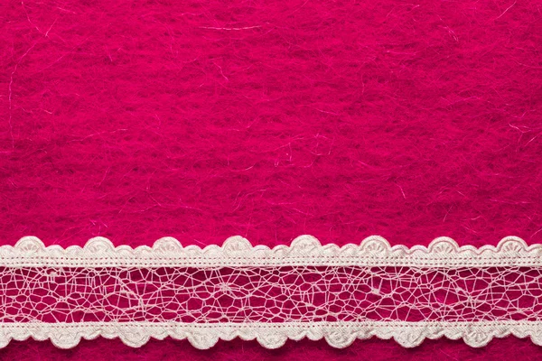 Encaje blanco vintage sobre fondo rosa — Foto de Stock