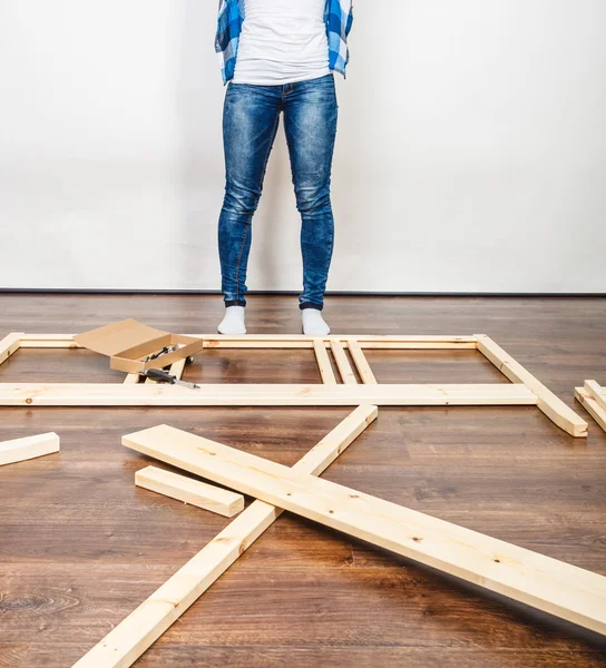 Woman assembling wood furniture. DIY. — Stock Photo, Image