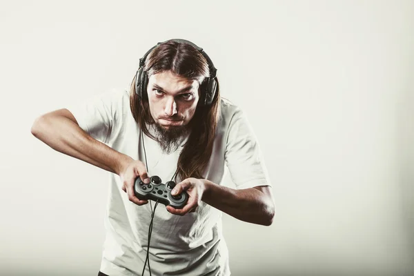 Stressed man playing on pad — Stock Photo, Image