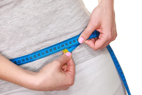 Woman measuring her hips closeup — Stock Photo, Image