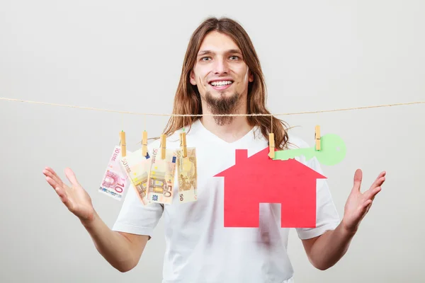 Man seller with money and house — Stock Photo, Image