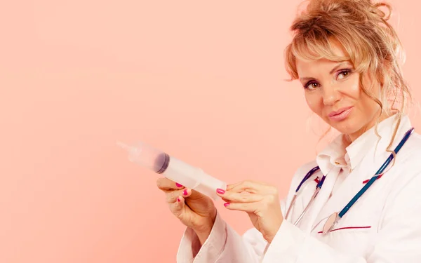 Nurse with big syringe. — Stock Photo, Image