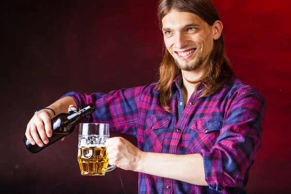 Tapster fills stein from bottle. — Stock Photo, Image