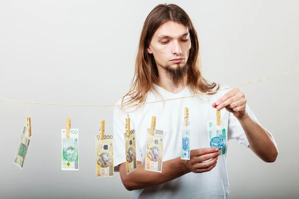 Rich man with laundry of money — Stock Photo, Image