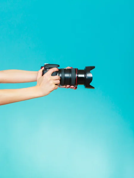 Photographer hands holding camera shooting images — Stock Photo, Image