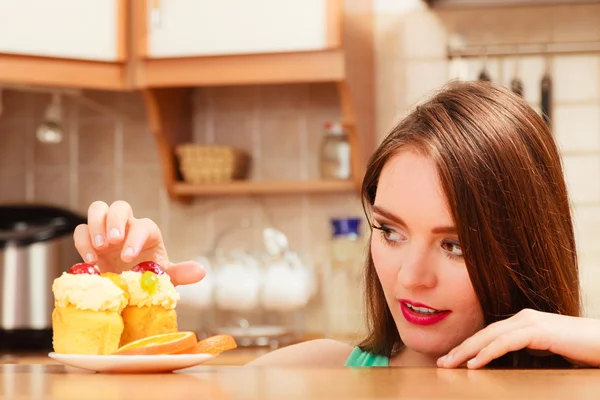 Woman eating delicious sweet cake. Gluttony. — Stock Photo, Image