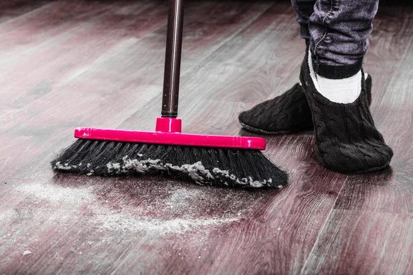 Cleaning woman sweeping wooden floor — Stock Photo, Image