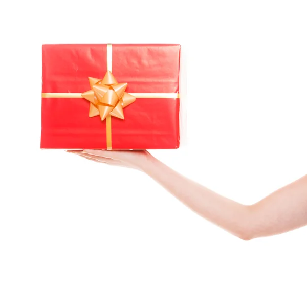 Female hand holding big red gift box isolated — Stock Photo, Image