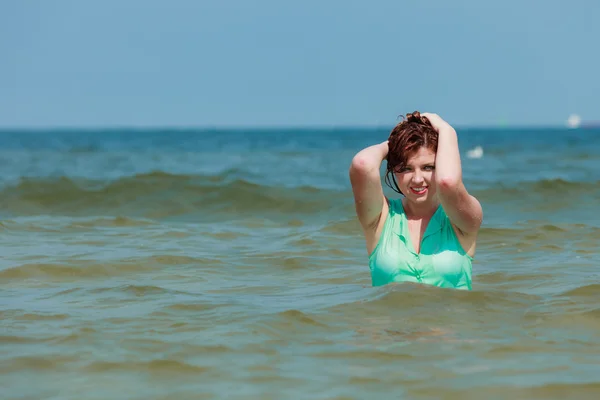 Sensual girl wet cloth in water on the coast. — Stock Photo, Image