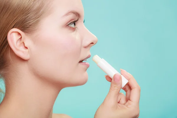 Woman applying balsam for lips — Stock Photo, Image