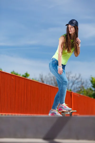 Teen girl skater riding skateboard on street. — Stock Photo, Image