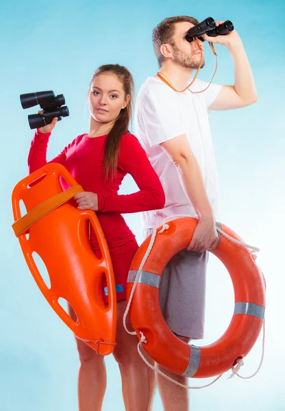 Lifeguards on duty looking through binoculars — Stock Photo, Image
