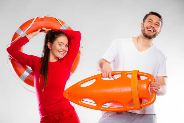 Lifeguard couple with rescue equipment — Stock Photo, Image