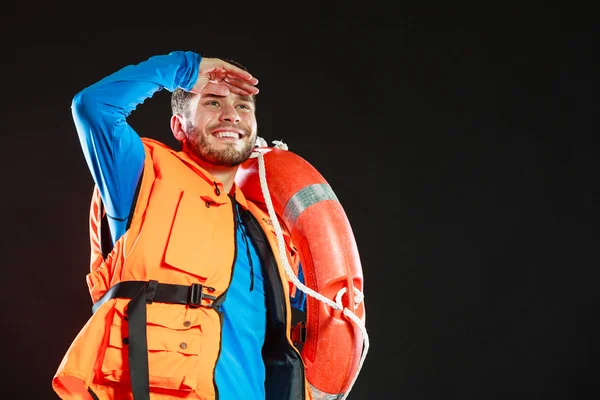 Lifeguard in life vest with ring buoy lifebuoy. — Stock Photo, Image