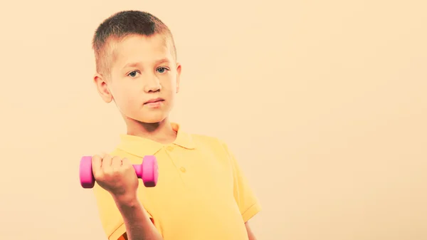 Sports boy making exercise with dumbbell. — Stock Photo, Image