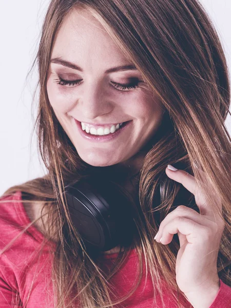 Cheering girl wearing headphones. — Stock Photo, Image