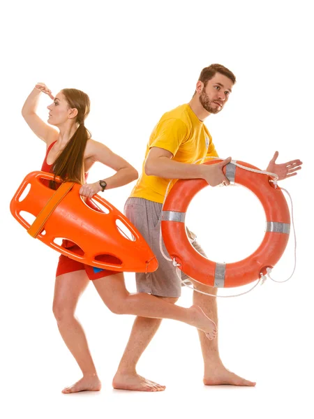 Lifeguards running with rescue ring buoy on duty. — Stock Photo, Image