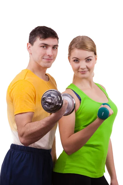 Couple exercising with dumbbells lifting weights — Stock Photo, Image