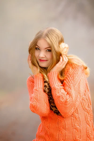 Cute girl in earmuffs outdoor