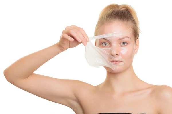 Girl removing facial peel off mask — Stock Photo, Image